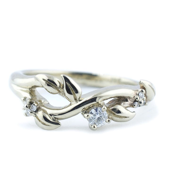 Custom engagement ring with the infinity symbolism and leaf details by Abby Sparks Jewelry.