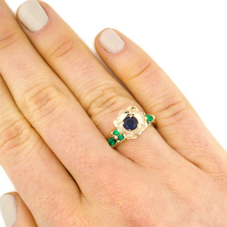 A custom engagement ring yellow gold sapphire emerald tulip designed by Abby Sparks Jewelry