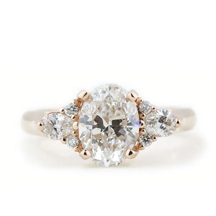 Oval Diamond Side Stone Cluster Ring