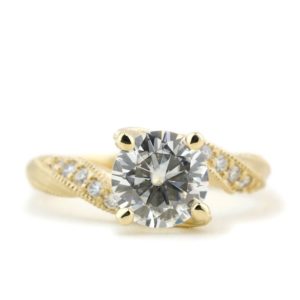 Custom made yellow gold and moissanite engagement ring designed by Abby Sparks Jewelry