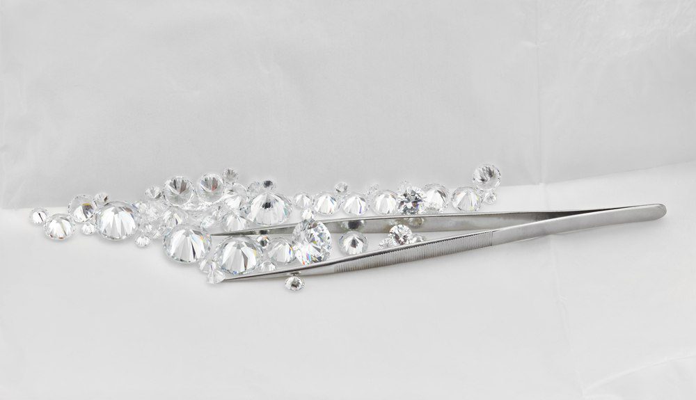 How to Make Your Diamond Engagement Ring Pop (with Melee Diamond Accents)