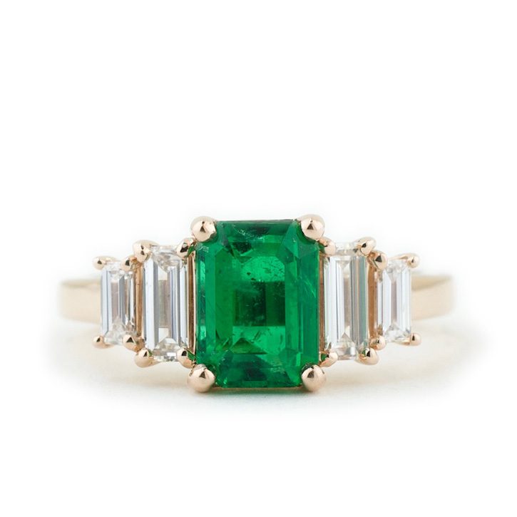 The Jennifer, a bold engagement ring made with a stunning emerald and diamonds, designed by Abby Sparks Jewelry.