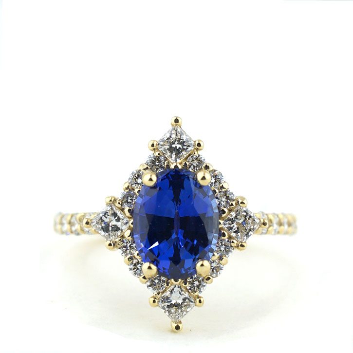 Oval Cut Sapphire and Diamond Halo Ring