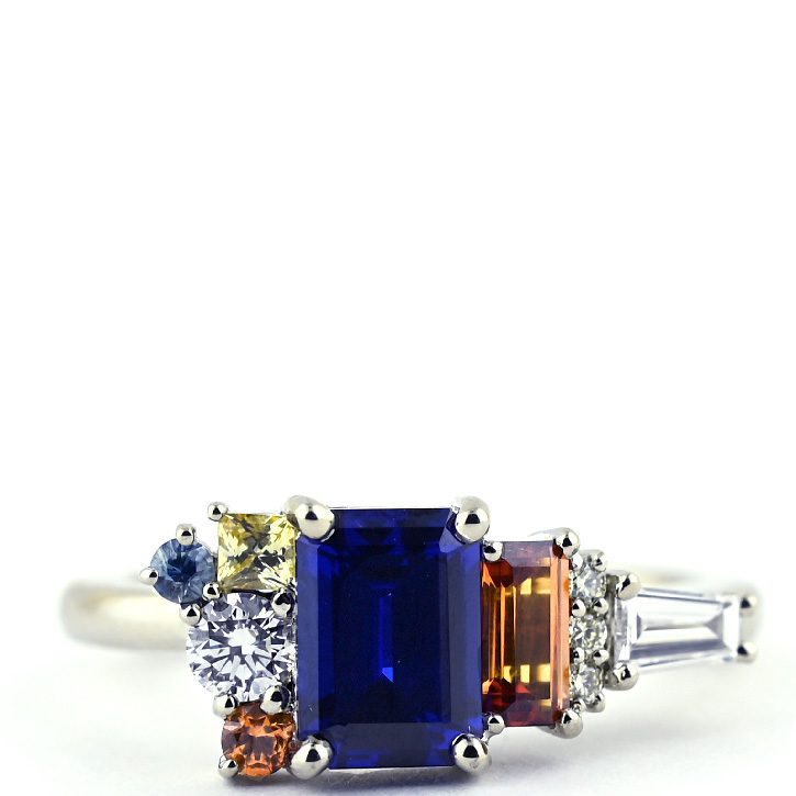 The Audrey, a deep blue sapphire ring made with geometric side stones, designed by Abby Sparks Jewelry.