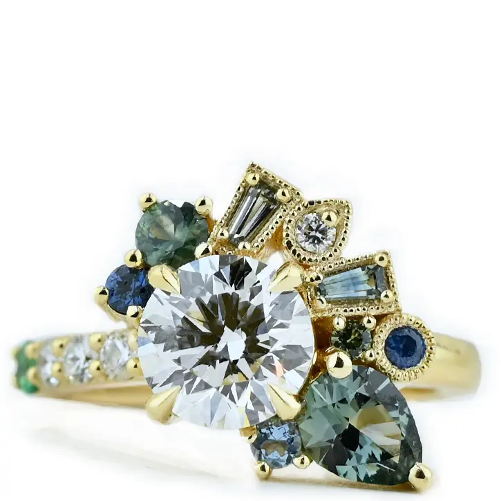 Asymmetrical colored gemstone engagement ring designed by Abby Sparks Jewelry